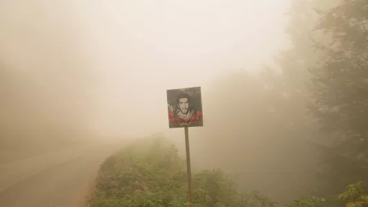 Sana Ahmadizadeh. Martyr: Portrait of a martyr from the Iran-Iraq war that has been installed next to a road, in this war more than three hundred thousand Khuzestan families were forced to migrate to other cities. (Gilan Province, North of Iran, 2018)