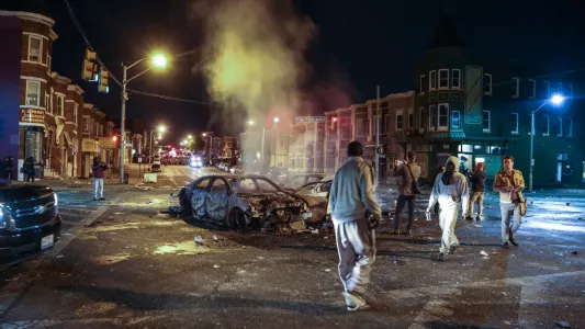 KAITLIN NEWMAN. Protestors and rioters throw Molotov cocktails at police and are greeted back with pepper spray and smoke. For several days cars were blown up and property was destroyed.