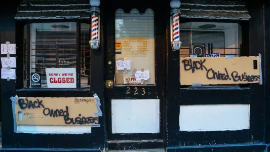 KAITLIN NEWMAN. Baltimore suffered a series of days with rioting and looting. Businesses boarded up their windows, or had theirs smashed and property stolen. Some Black business owners posted signs like this to discourage looting and vandalism.