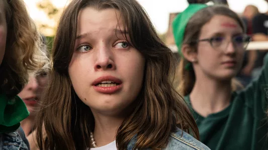 RAQUEL NATALICCHIO. A young girl cries amongst hundreds of people gathered outside of the U.S. federal courthouse in Downtown Los Angeles to protest the leaked draft opinion that suggests the Supreme Court's potential decision to reverse Roe vs Wade.