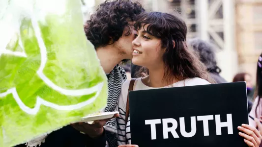 sam davis. Animal Rebellion supporters holding Truth sign in Parliament Square, London 2020